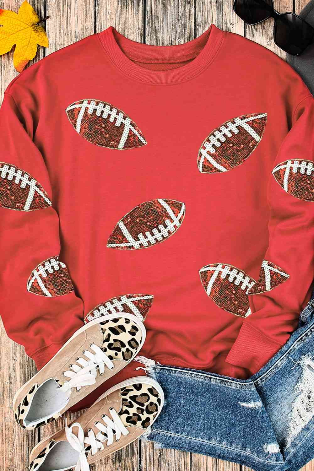 red sweater with sequin footballs
